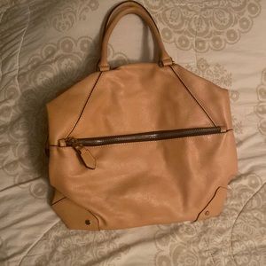 Urban Expression Tan “Bowling Bag” crossbody bag.